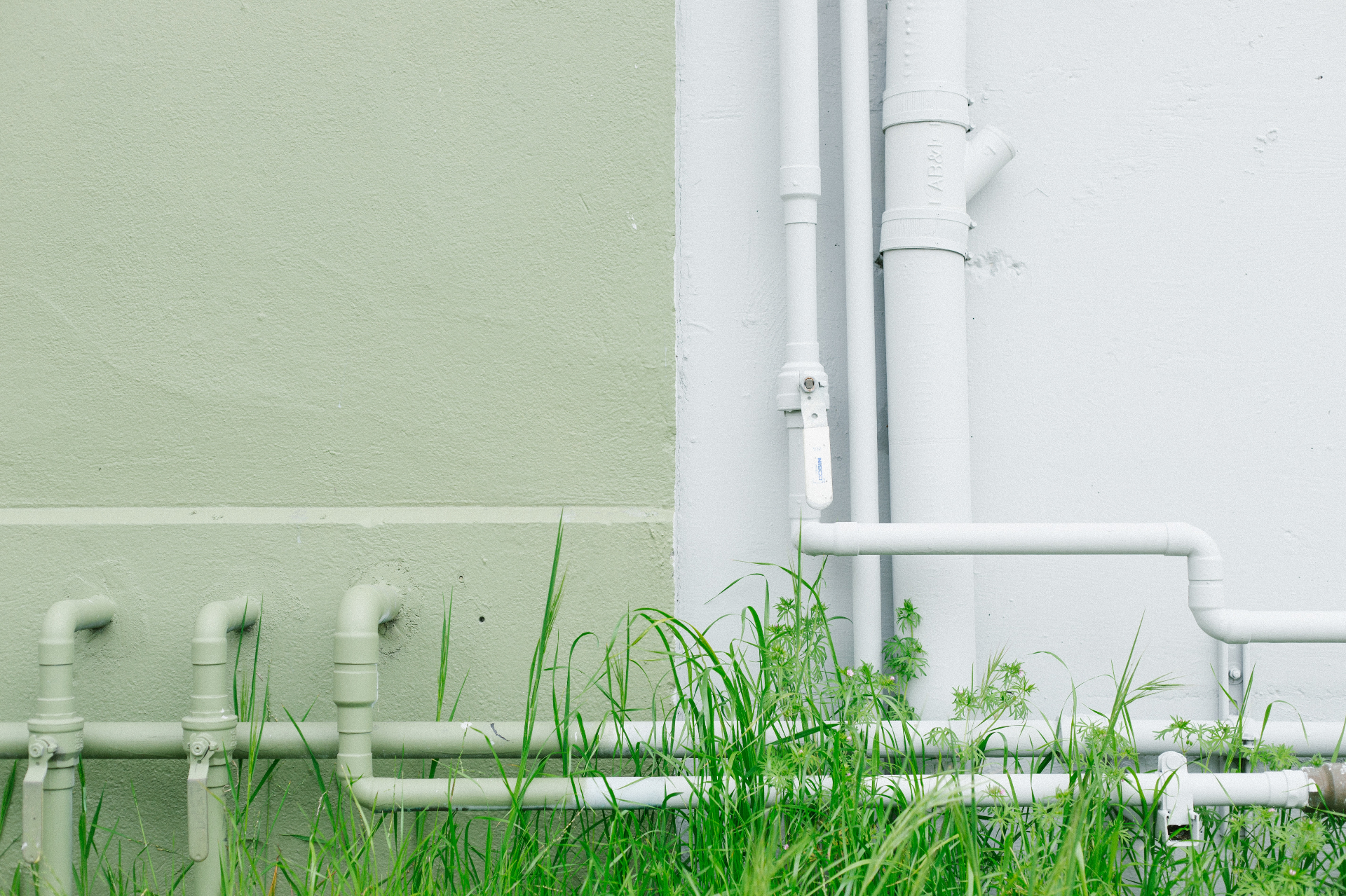 Plumber installing an outdoor garden tap at a Kingston property